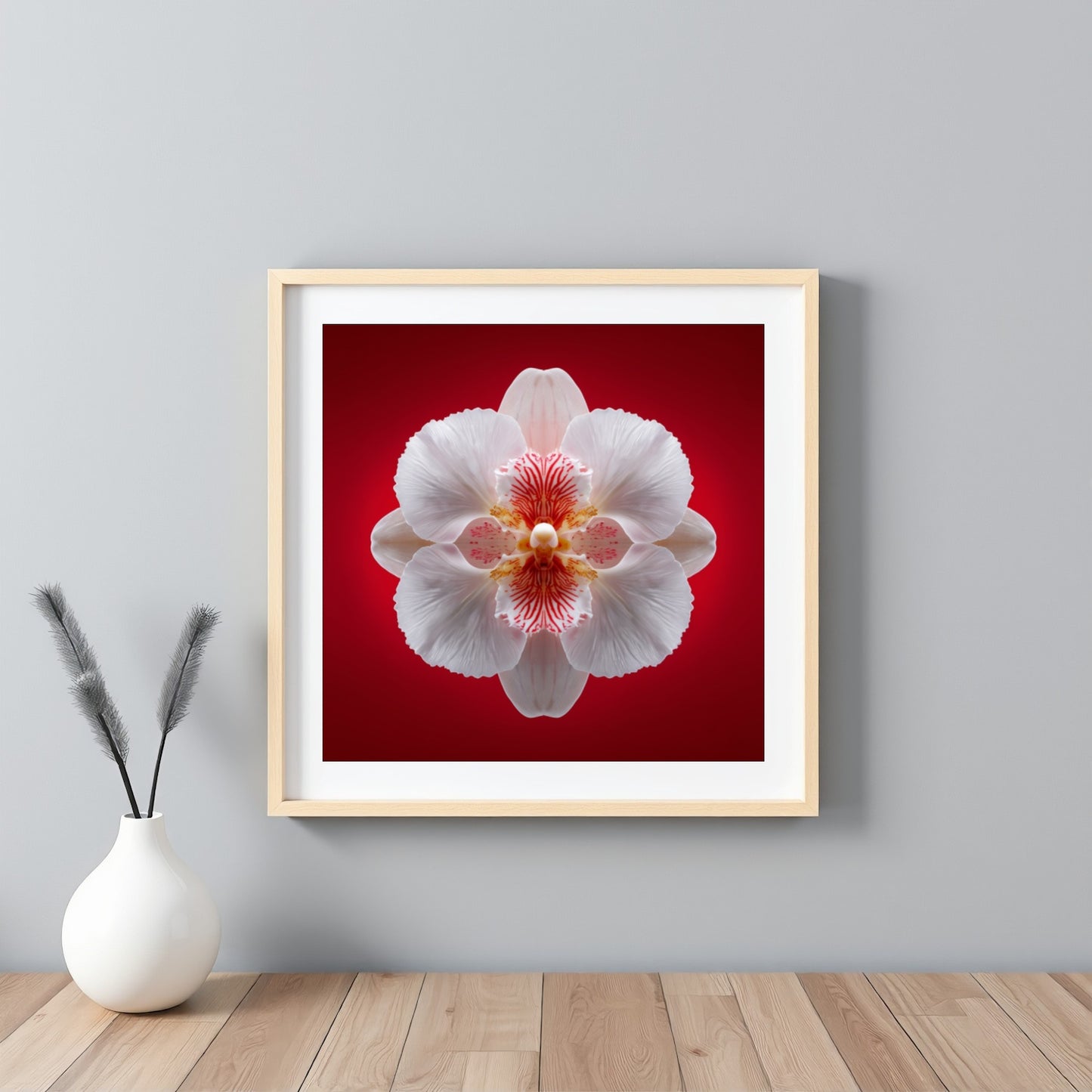 Scarlet Bloom print – bold red backdrop with white orchid in mirrored form, dramatic botanical artwork framed white