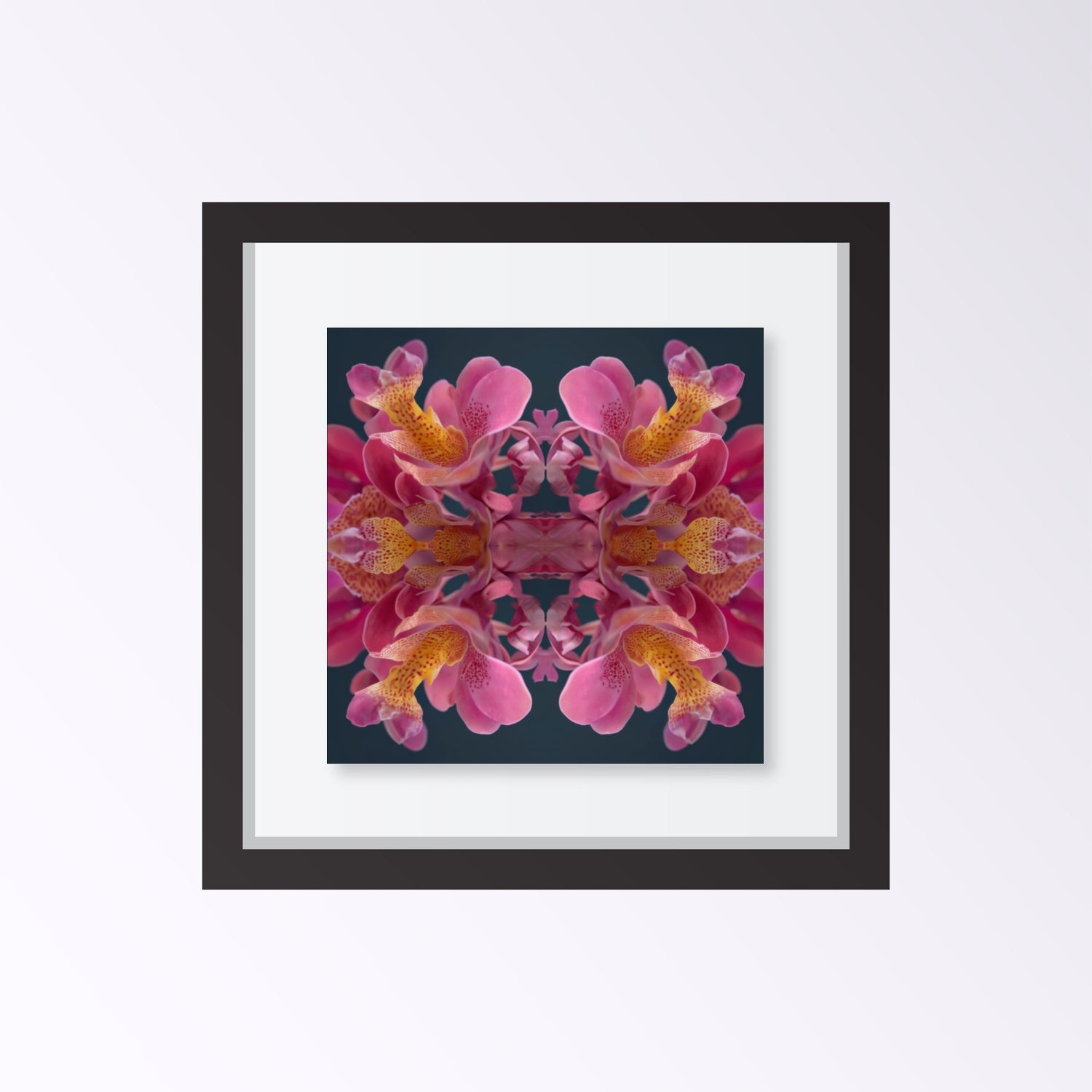 Pink Orchid Reflection print – lush magenta orchid blossoms mirrored in bold symmetry, tropical floral art framed black